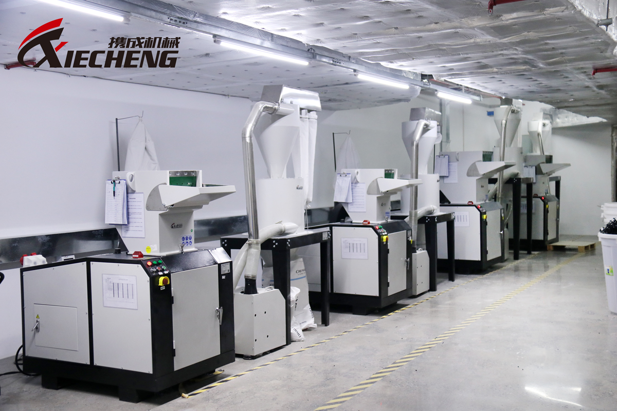  A plastic granulator operating in an industrial recycling environment.